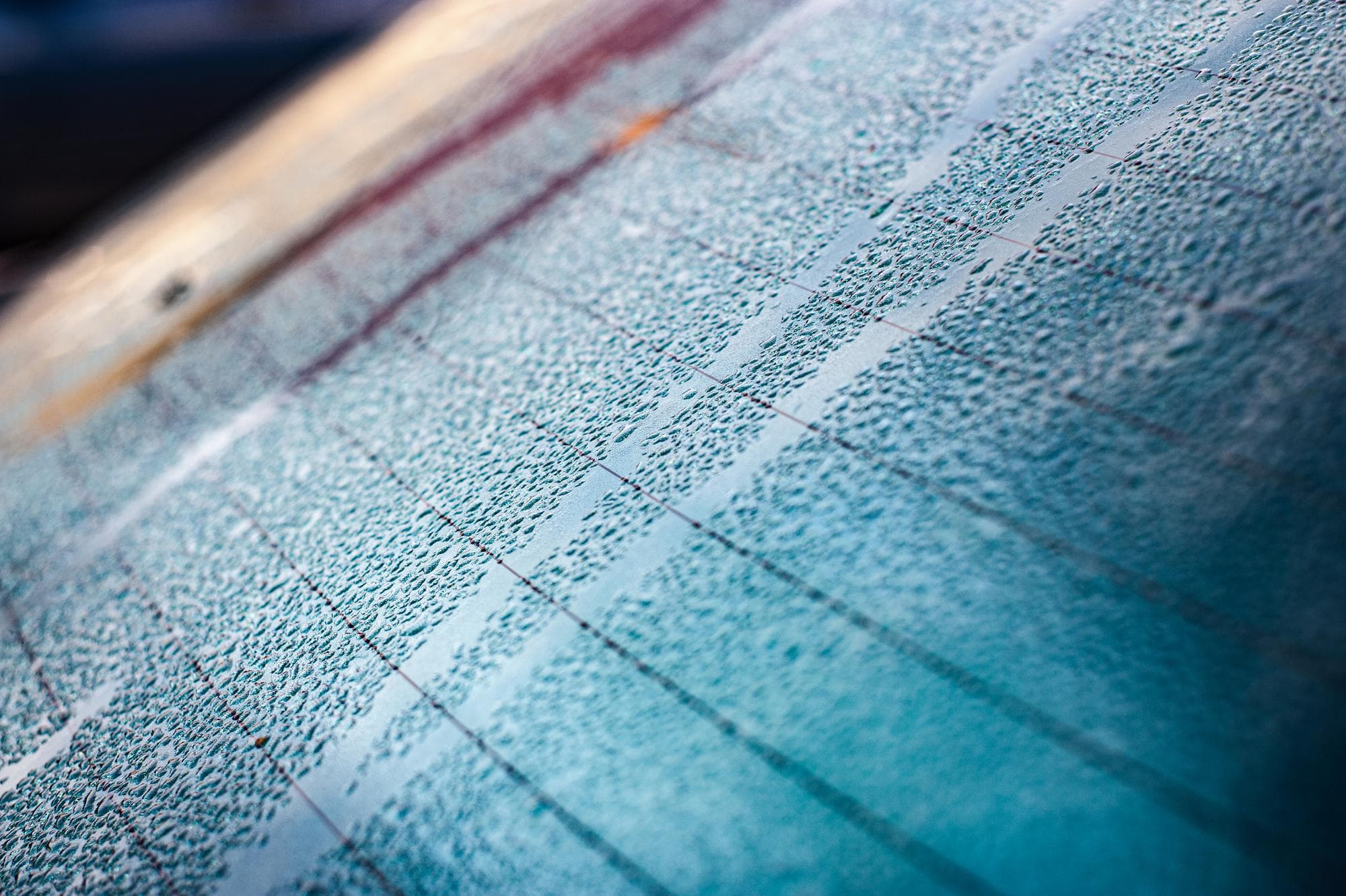 Water beading on a freshly ceramic-coated car