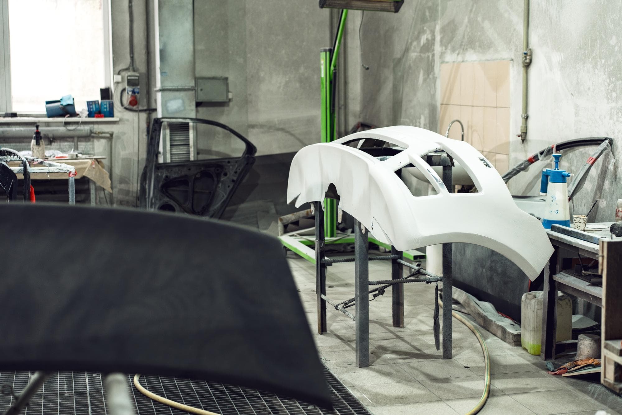 Auto body technician repairing a car panel